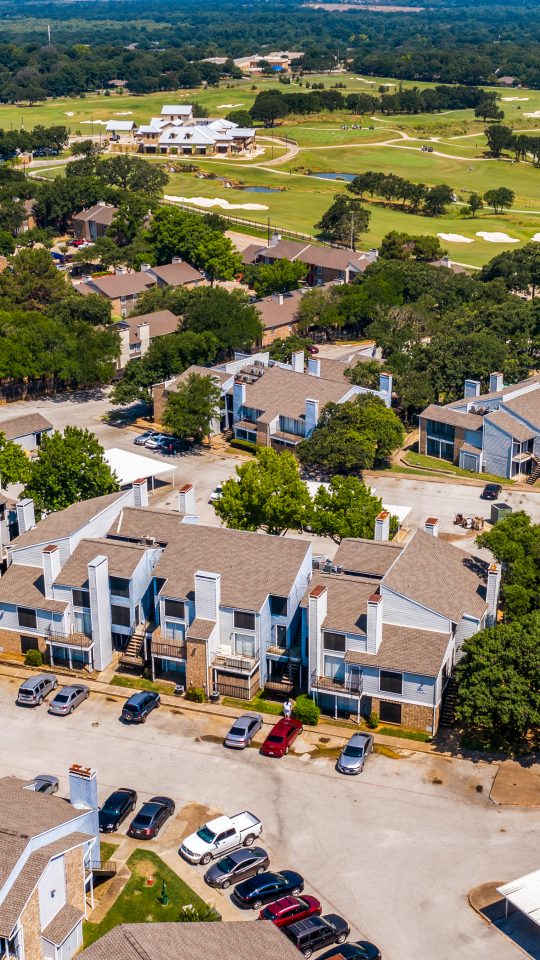 an aerial view of the apartment complex in the suburbs at The  Biltmore